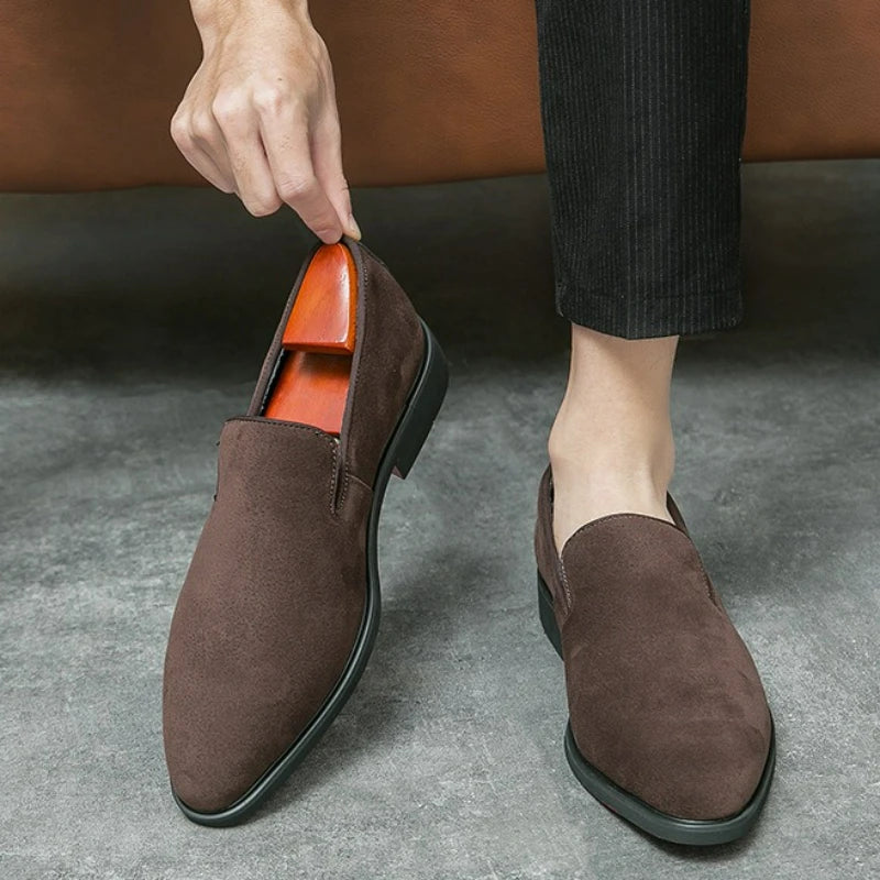 Sophisticated slip-on loafers in soft suede with bold red sole and pointed toe detail