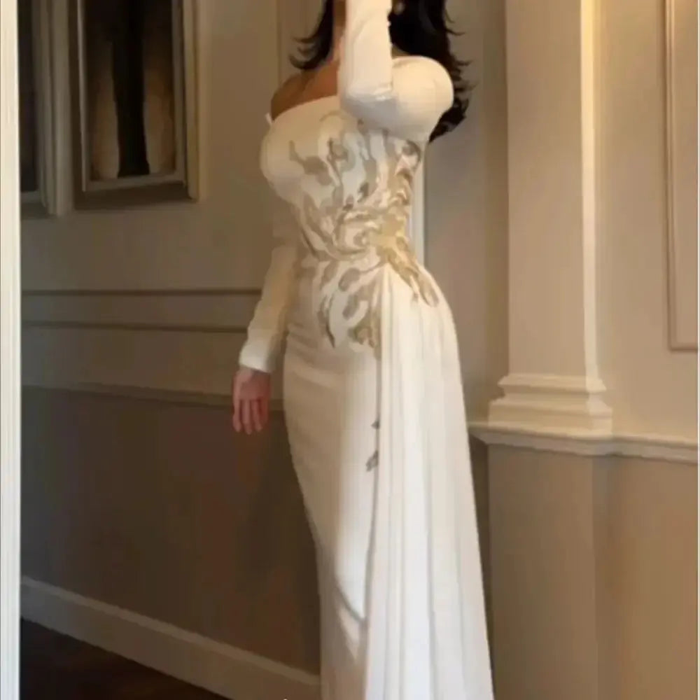 Model wearing a luxurious satin gown with a sweeping train, exuding confidence at a gala.