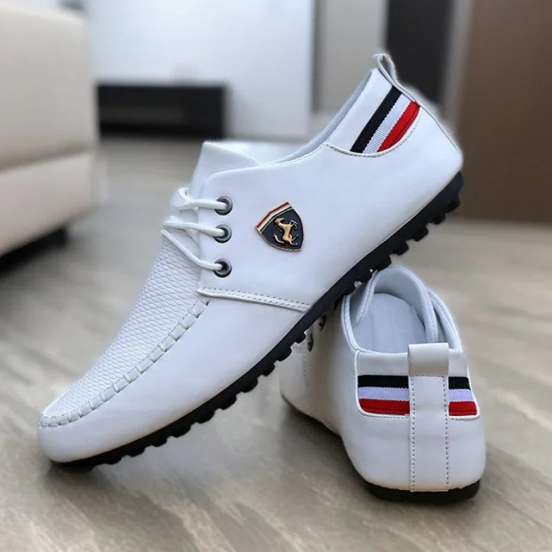 Close-up of loafers showcasing subtle metal decoration and sleek design.