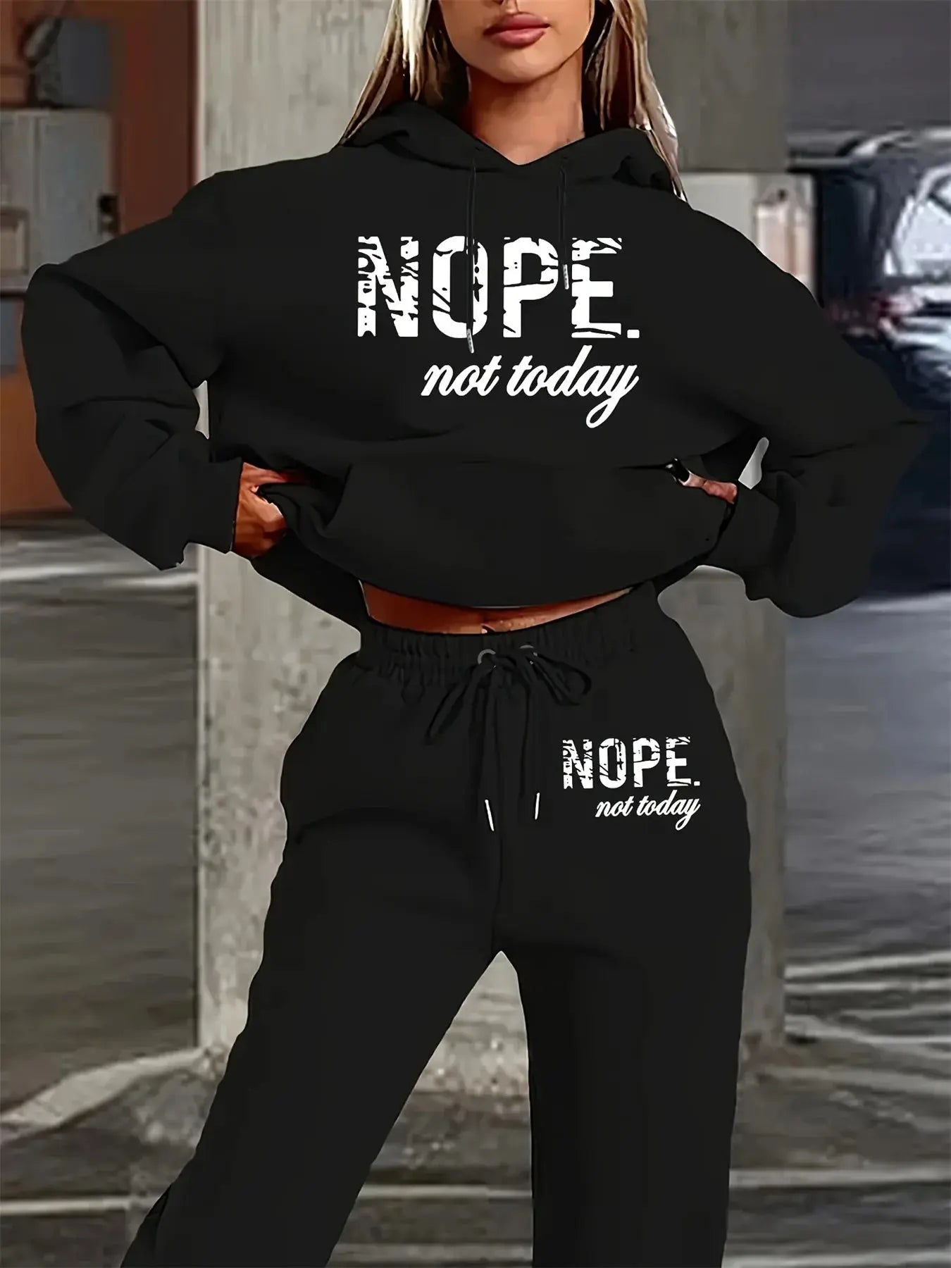 Hip hop street style matching hoodie and sweatpants set in black polyester with statement text design