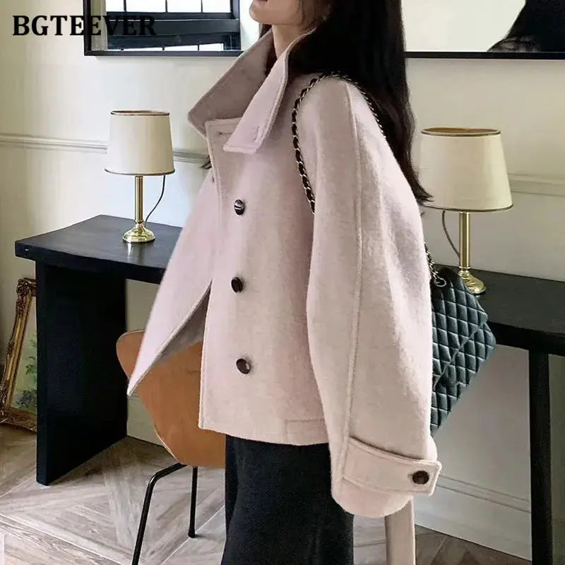 Cozy winter coat showcasing a sleek silhouette and adjustable waist for a flattering fit.