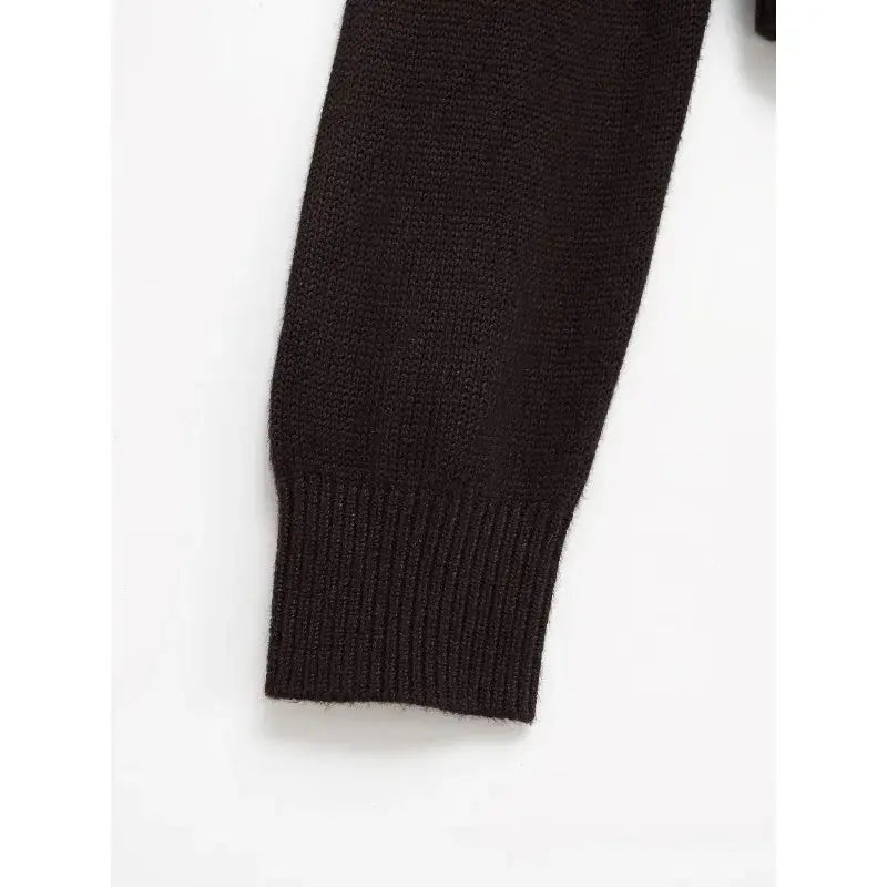 Back view of the Autumn Whispers cardigan, highlighting its elegant knitwear design and cozy fit.