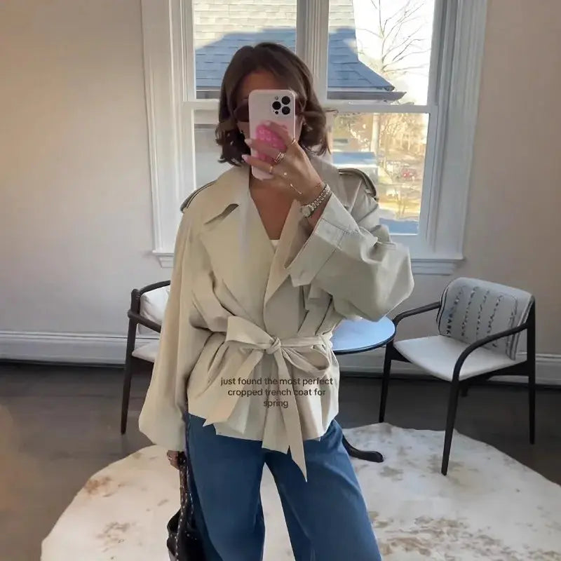 Close-up of the tie closure detail on the breathable women's jacket.