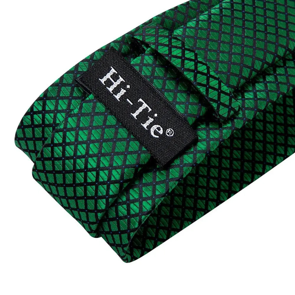 Full view of the silk tie set with paisley and plaid details.