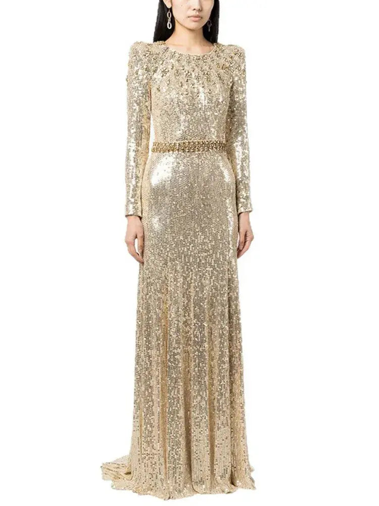 Close-up of shimmering sequins on the fitted waist of the gown, showcasing luxury.