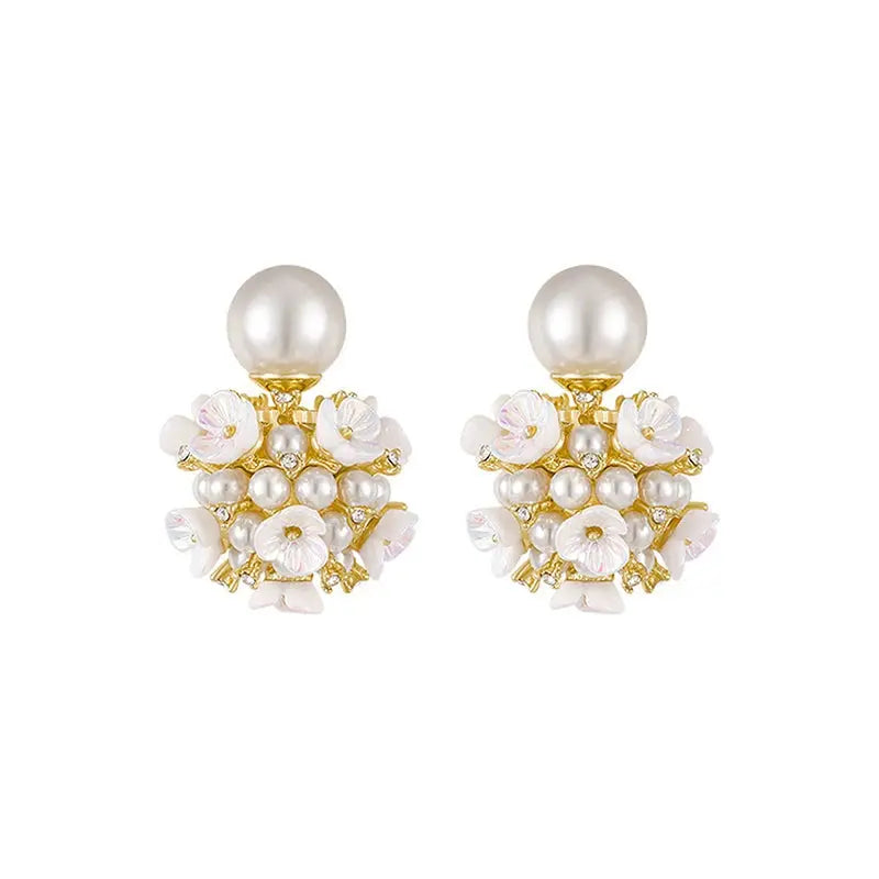 Modern classic jewelry, lightweight pearl stud earrings designed for all-night comfort.