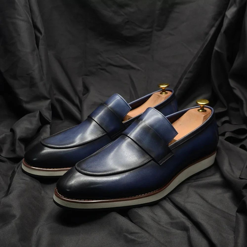 Close-up of genuine leather penny loafer showing expert craftsmanship and supple sheepskin insole