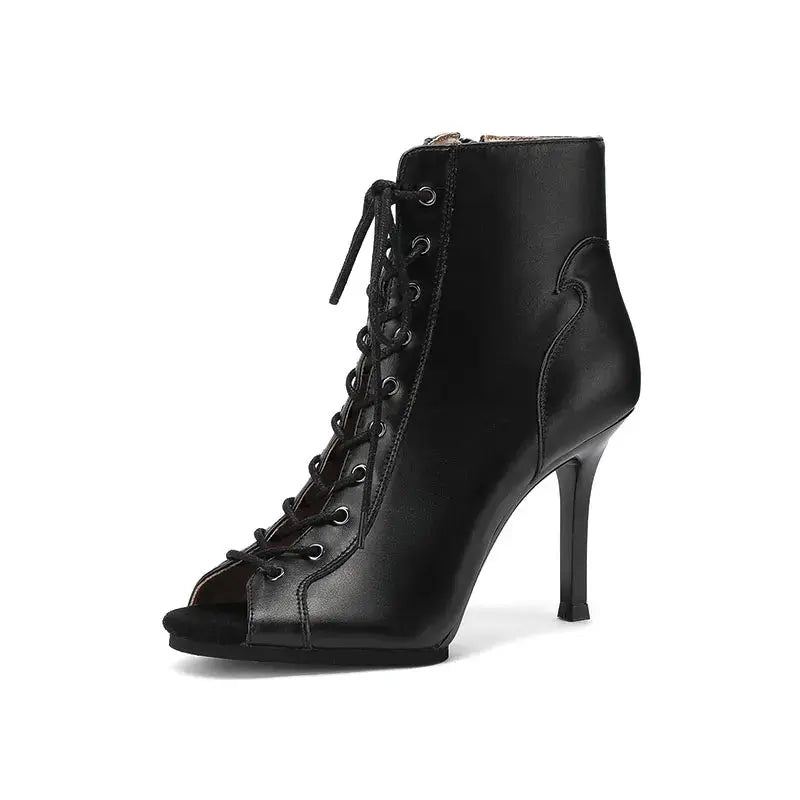 Dynamic movement captured in high-heel dance boots during practice.