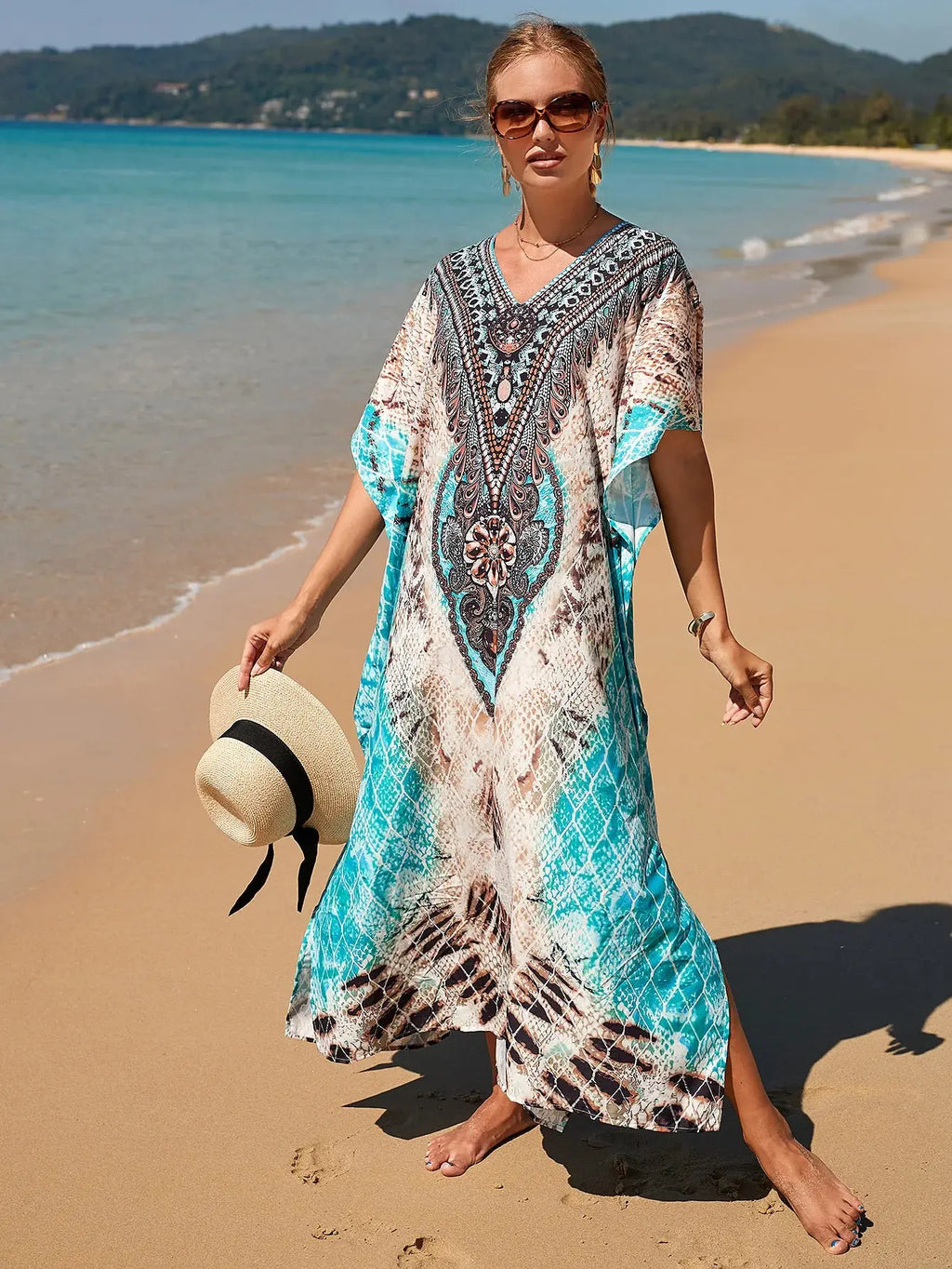 Breeze Whisper Kaftan styled as a beach cover-up, ideal for poolside lounging and sunbathing.