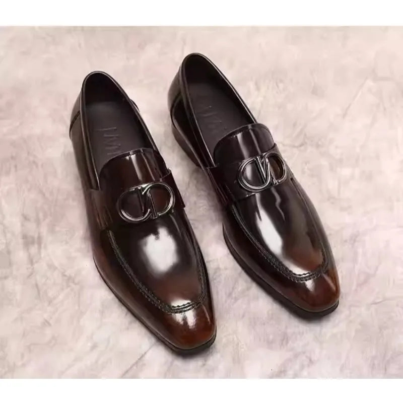 Handcrafted leather loafers in polished black, showcasing refined British style.