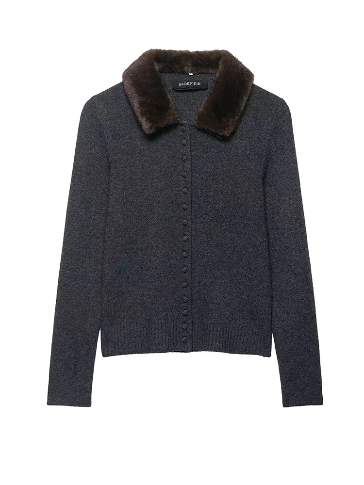 Flat lay of the Autumn Whisper Cardigan with autumn leaves, perfect for seasonal fashion.