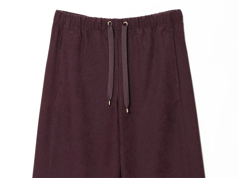 Close-up of bomber jacket's integrated hood, blending fashion and functionality.