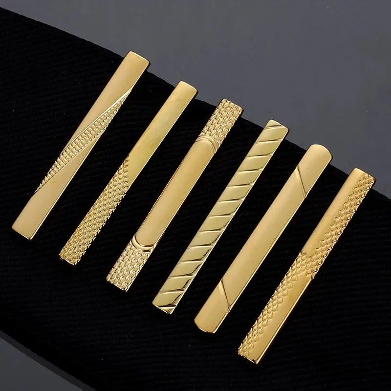 Subtle men's jewelry: rose gold tie clip for confidence.