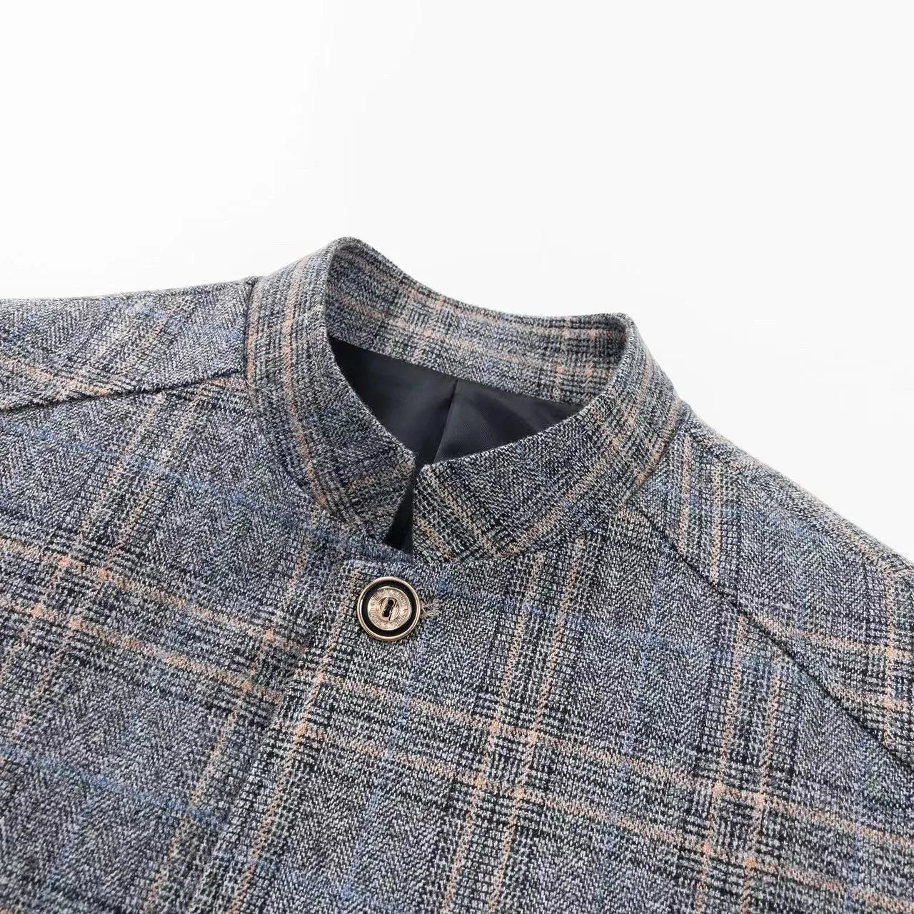 Detail of the vertical stripes on the blazer, emphasizing its distinctive style and British tailoring.