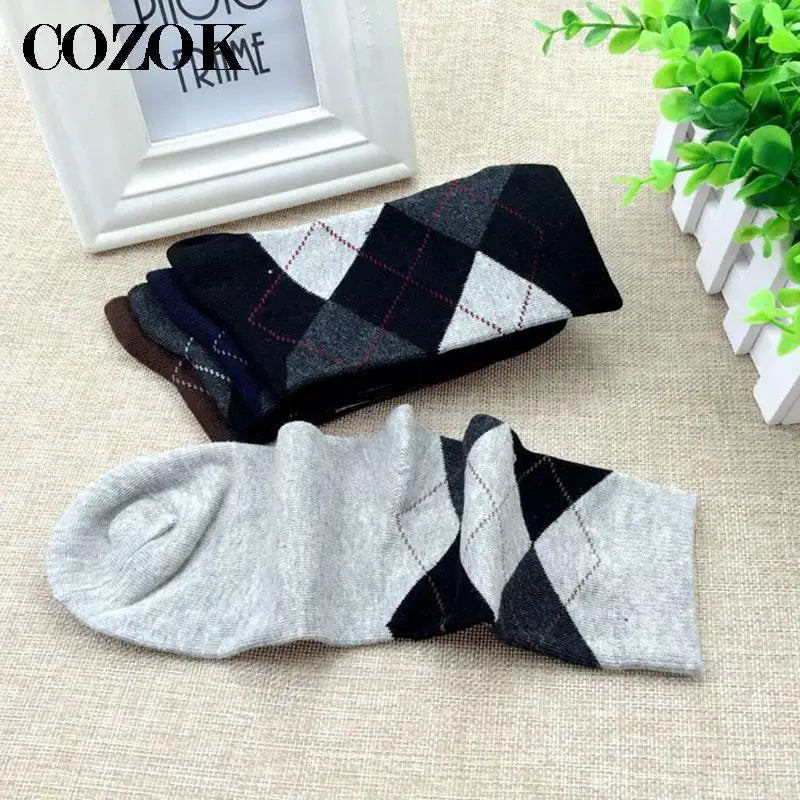 Breathable dress socks in gray with elegant patterns for business wear.