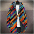 Winter Tribal Cardigan draped over a chair, showcasing its stylish design and colors.