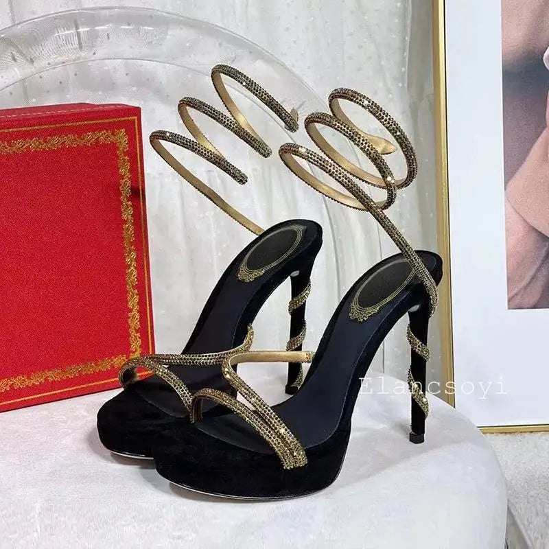 Back view highlighting the ankle strap design of the stiletto heels.