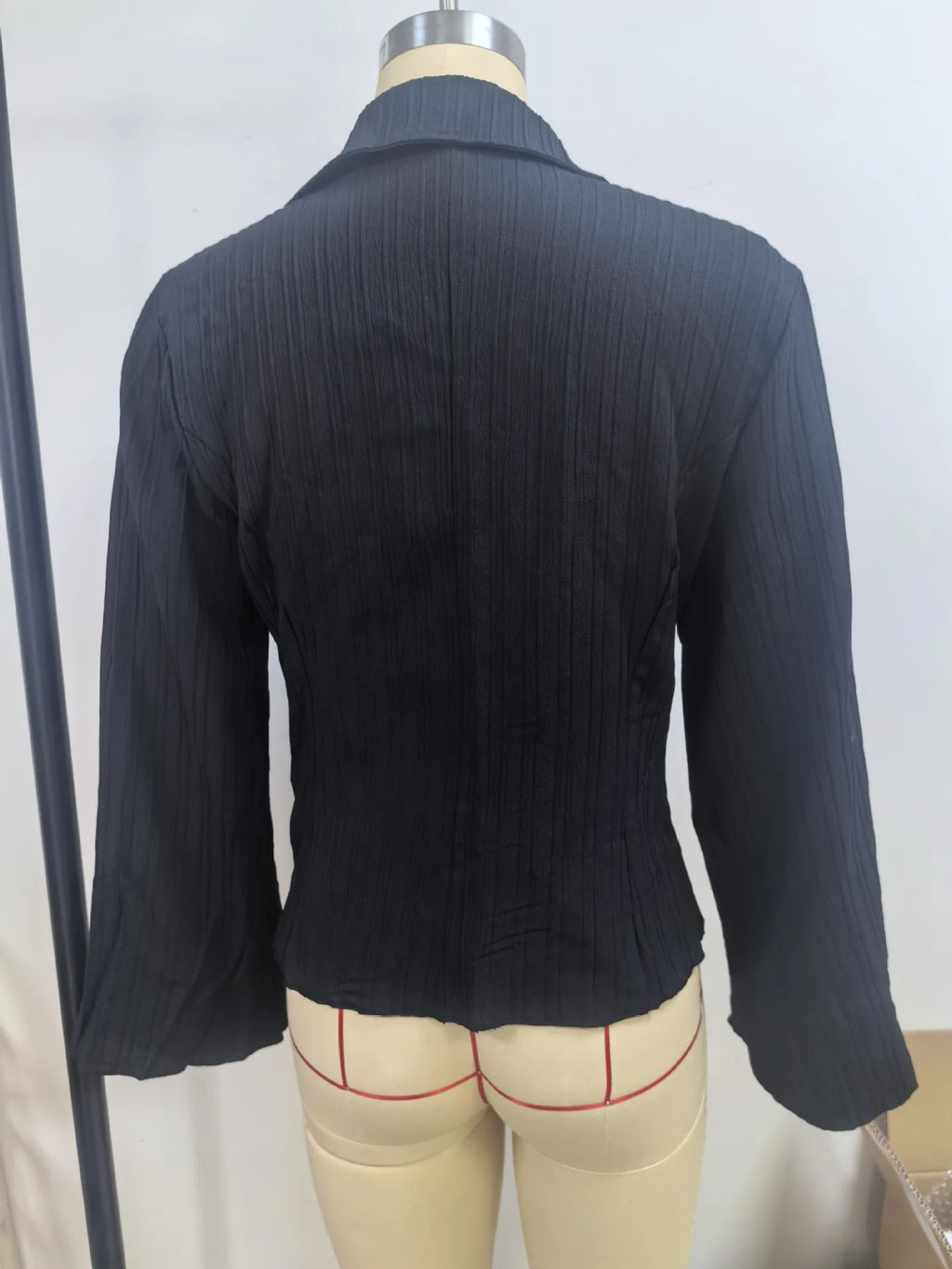 Slim-fit ribbed blouse with peplum waist detail and comfortable stretch fabric