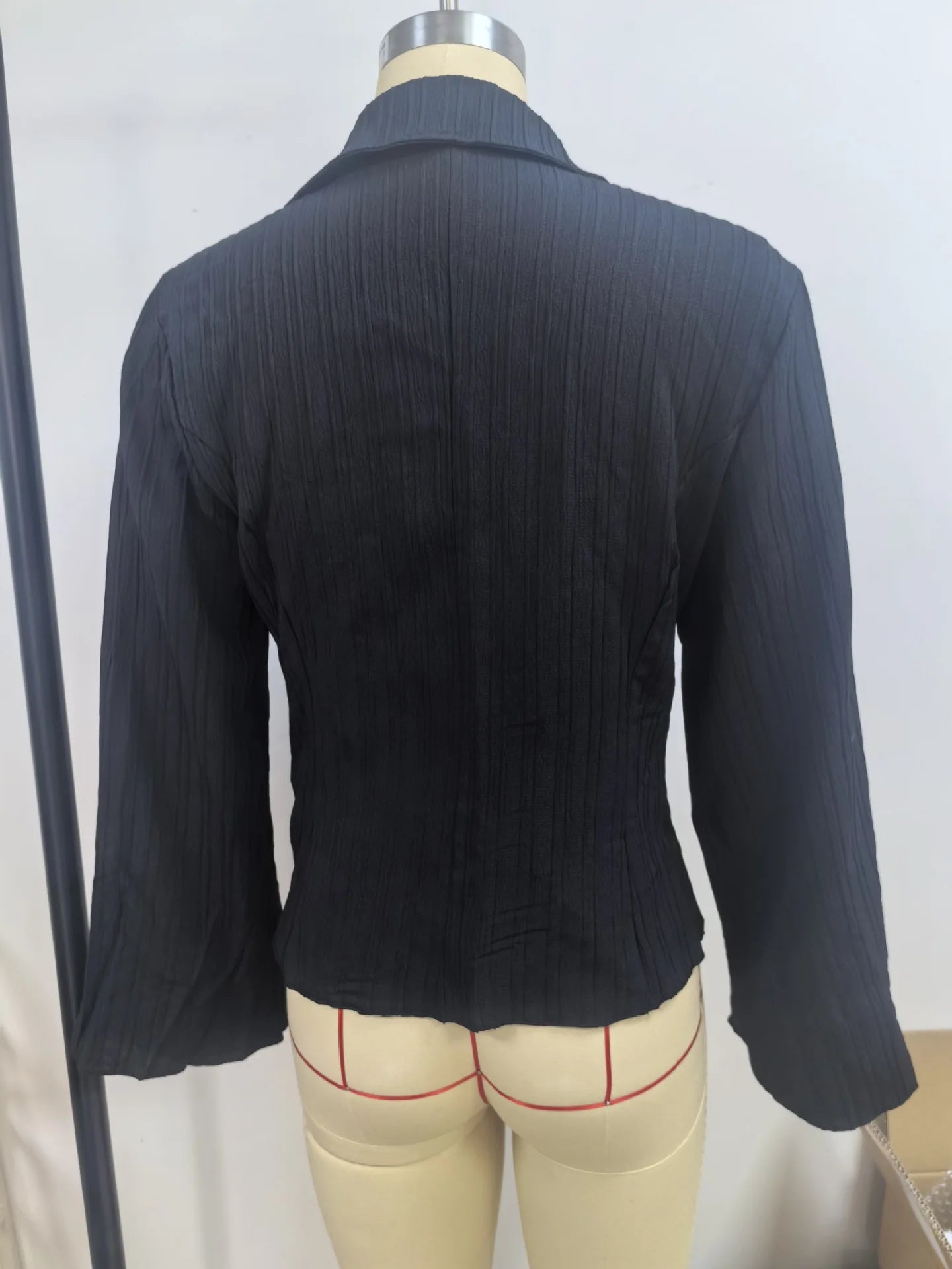 Slim-fit ribbed blouse with peplum waist detail and comfortable stretch fabric