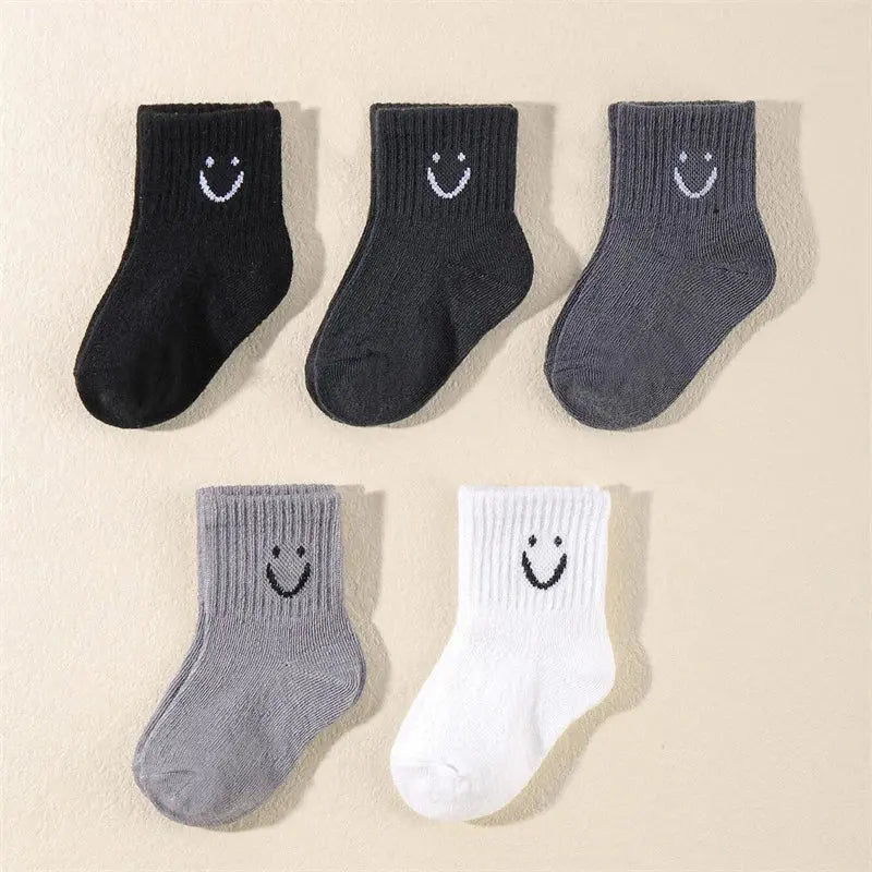 Bulk pack of ten pairs of cheerful children's socks, ideal for busy laundry days.
