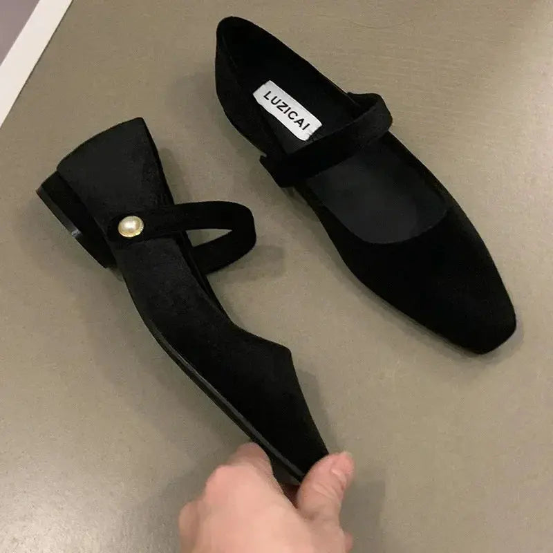 Side view of ballet flats showcasing the contemporary square toe and luxurious texture.