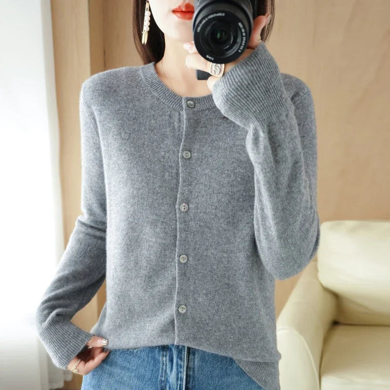 Model layering the Autumn Whisper Cardigan over a simple top for added warmth.