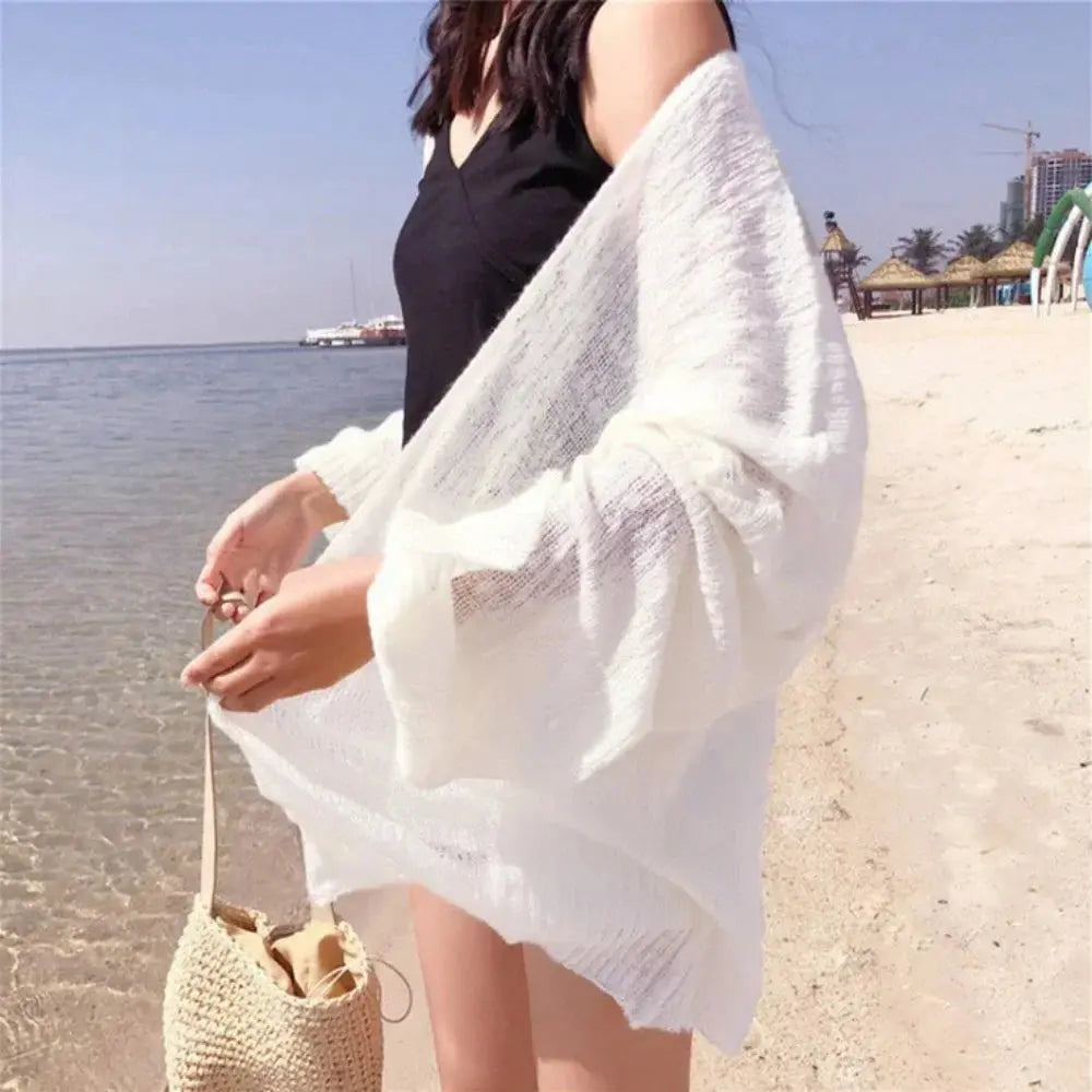 Back view of the Summer Breeze Knit Cardigan, featuring a streamlined silhouette and elegant design.