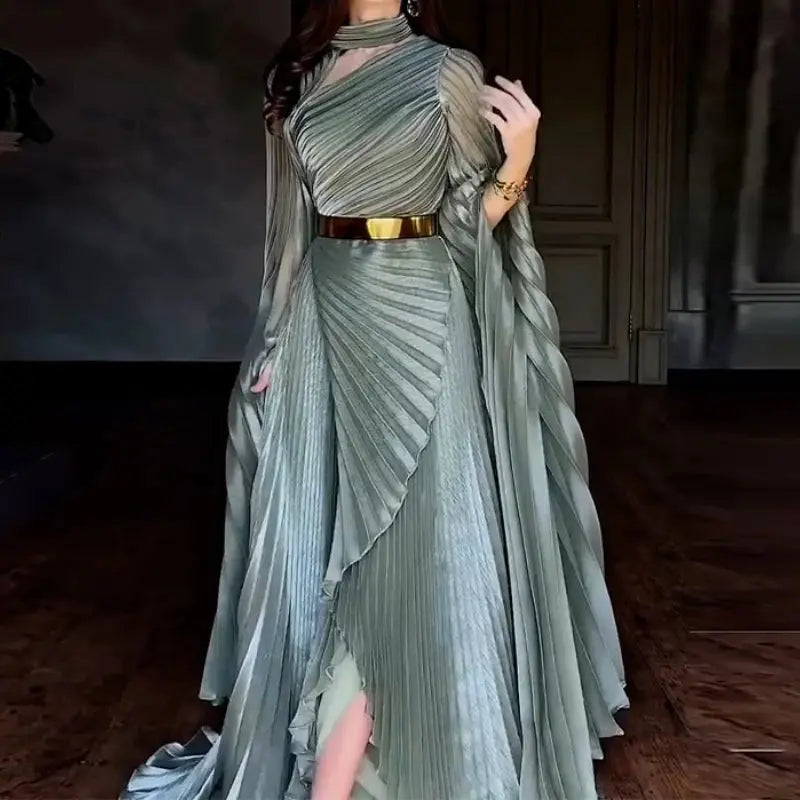 Model wearing Twilight Cascade gown showcasing the split feature and graceful drapery.