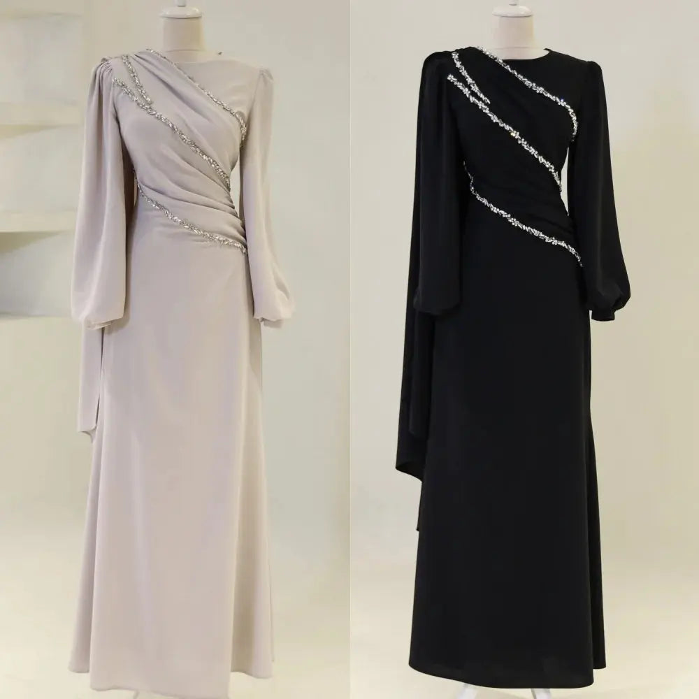 Elegant evening gown in flowing chiffon with delicate beading and sequins.