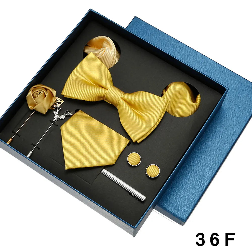 Luxurious formal tie set with matching bowtie, pocket square and cufflinks in gift box