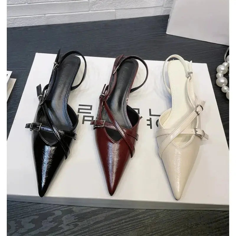 Leopard print heels with pointed toe and elegant buckle strap for stylish women's sandals.