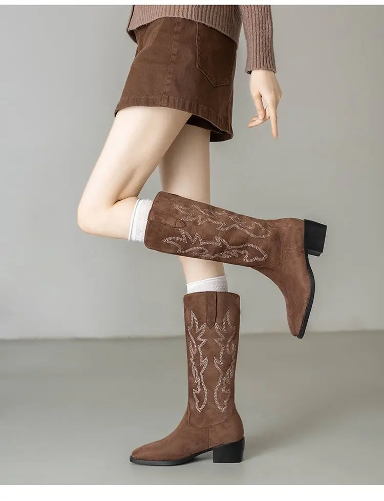 Embroidered leather boots styled with skinny jeans for casual look