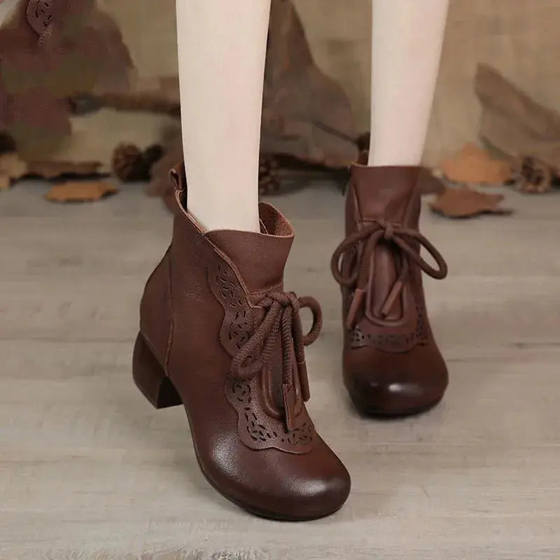 Waterproof exterior of Winter Whispers boots, perfect for snowy streets.