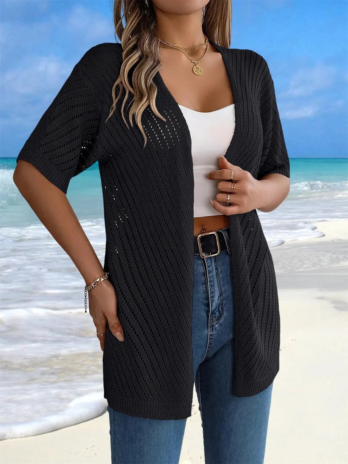 Chic short sleeves on a breathable crochet cardigan ideal for warm days.