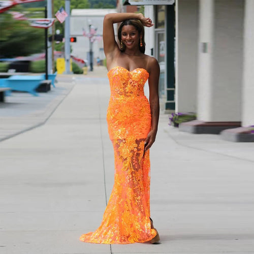 Sunset Glow Strapless Gown in orange lace, showcasing a mermaid silhouette and sweetheart neckline.