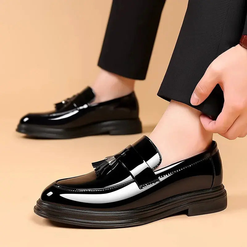 Elegant black faux leather slip-on shoes for men, perfect for business and formal occasions.