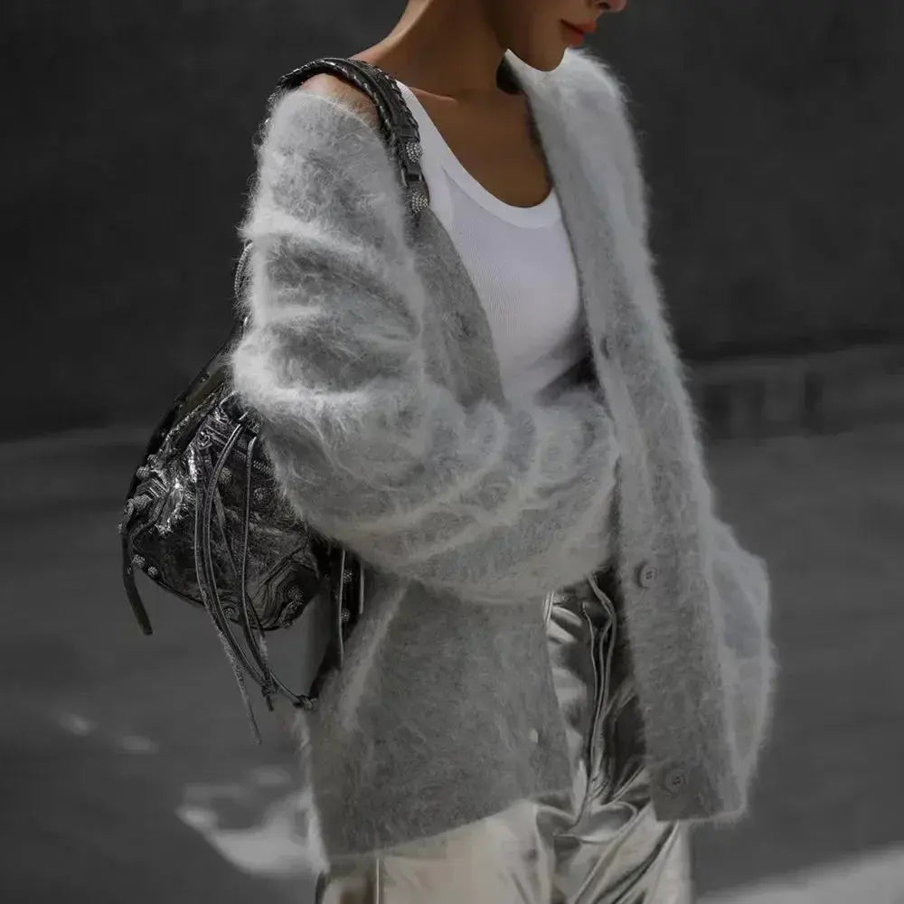 Cozy oversized knitwear in solid color, ideal for layering.