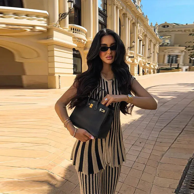 Chic striped knit ensemble featuring a sleek V-neck top and tailored straight-leg pants.