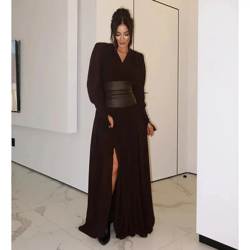 Full-length stylish dress with a dramatic deep V-neck, ideal for social affairs.