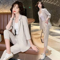 Back view of the green blazer highlighting the streamlined fit and elegant silhouette.