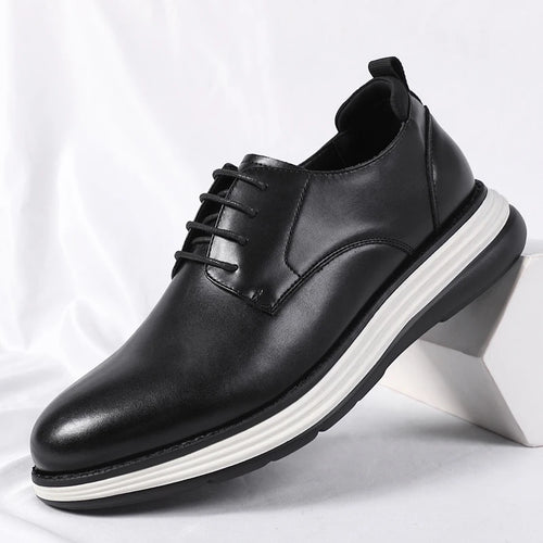 Black leather lace-up dress shoes with rubber sole on white background