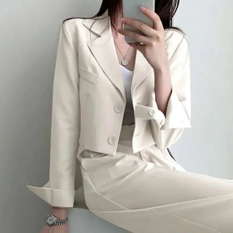 Back view of the tailored blazer, highlighting the structured design of the power suit.