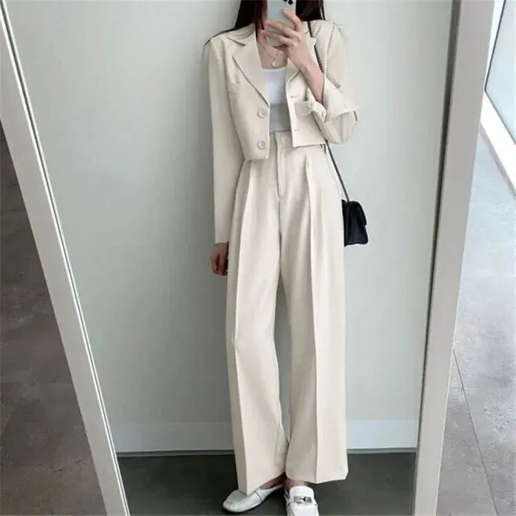 Flat lay of the chic wide-leg power suit, featuring the blazer and pants arranged neatly.
