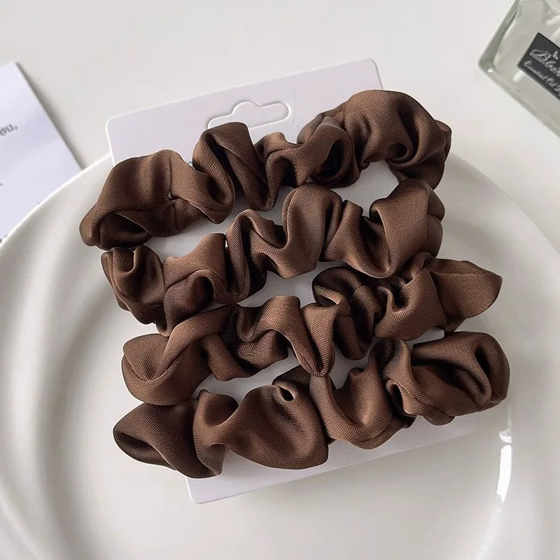 Elegant hair scrunchies in silky satin for confident damage-free styling