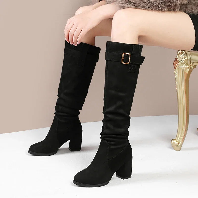 Elegant suede boots featuring waterproof construction and walkable heel height