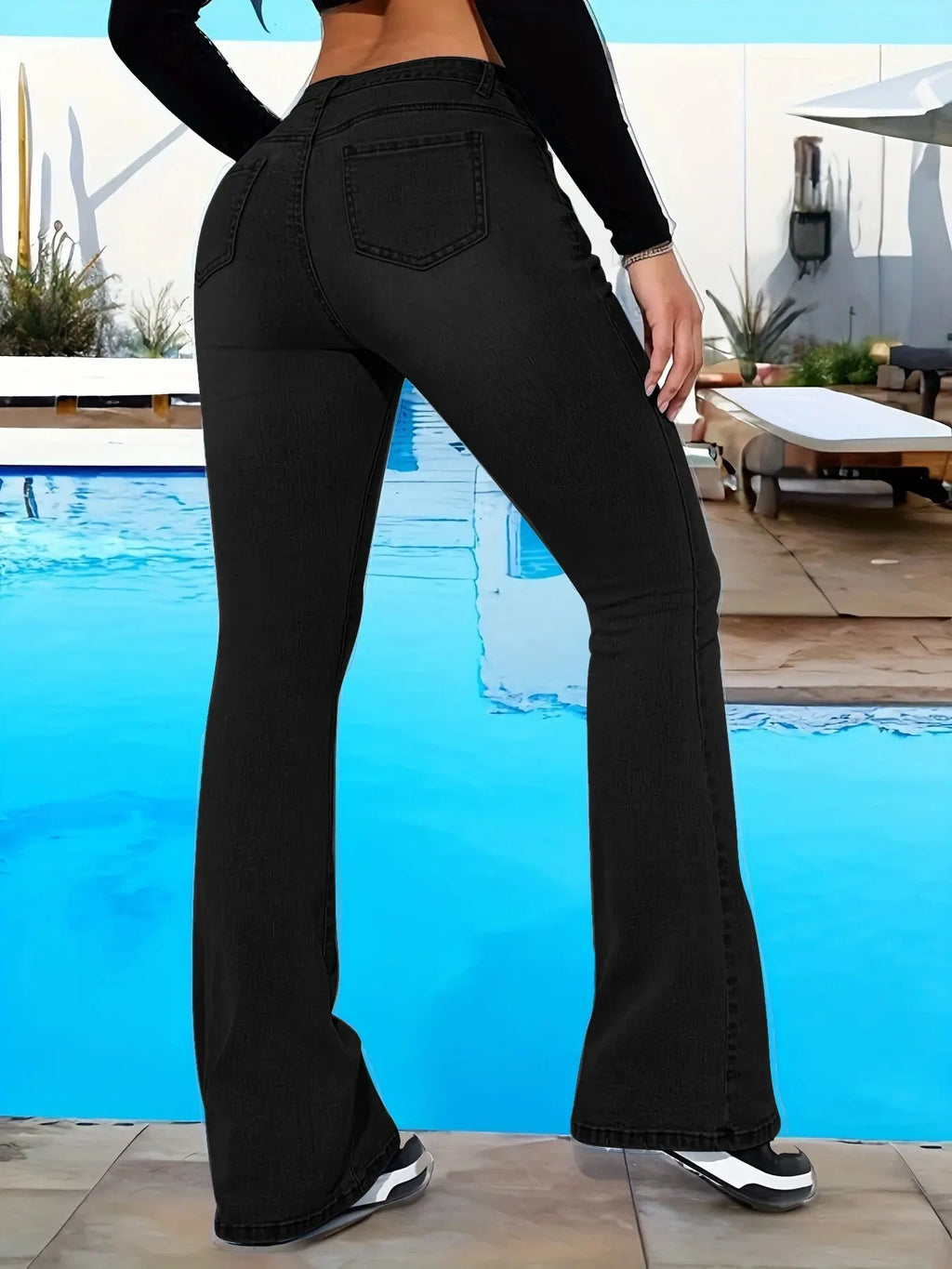 Back view of high-waist wide-leg jeans featuring practical pockets for essentials.