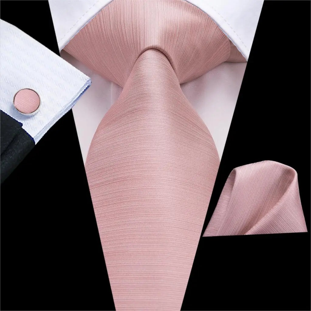 Three-piece gentleman's accessory set with textured paisley tie, hanky, and elegant cufflinks