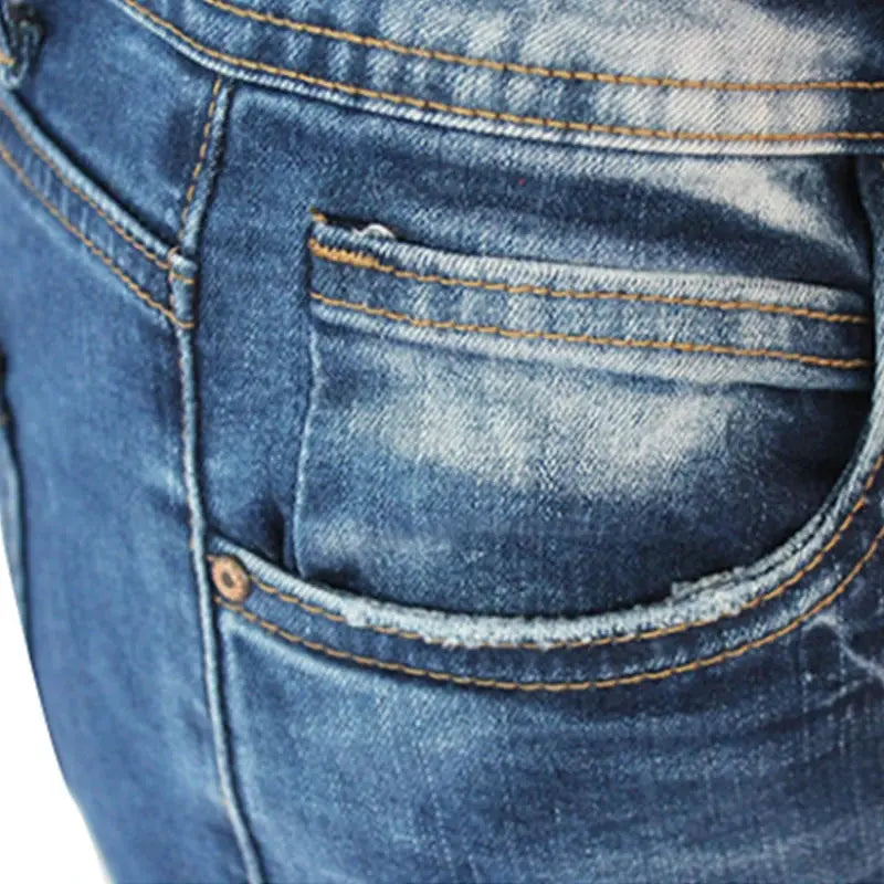 Side view of red ripped jeans, showcasing the breathable cotton blend and trendy edge.