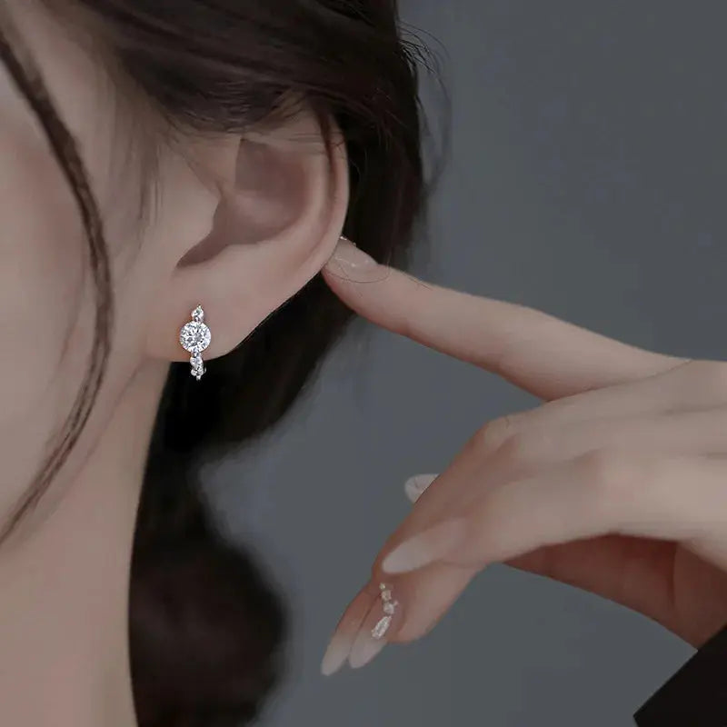 Lightweight zircon stud earrings on a model, demonstrating comfort and refined style.