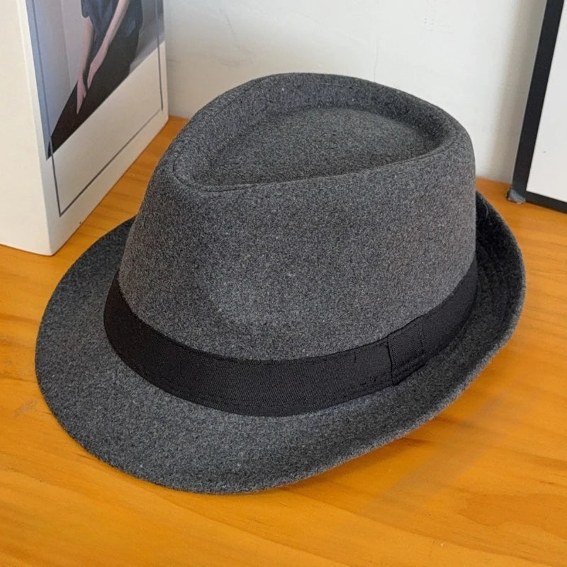 Detail shot of the wool blend fabric of Charcoal Whispers Fedora, highlighting durability and comfort.